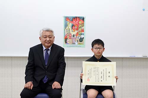 長門市危険物安全協会会長の大工さんと賞を受賞した清水さん
